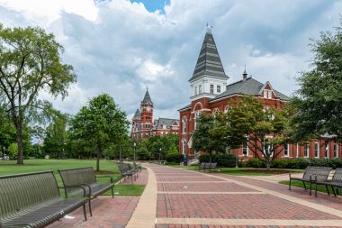Auburn, Alabama/USA- July 7, 2019: A scenic view looking down the walkway leading to Hargis Hall on the campus of Auburn University in the summer time.