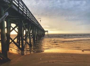 Sunrise over the horizon at the Isle of Palms Pier in South Caroline