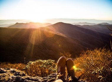 Photographer's boots and the mountains during sunset in North Carolina.