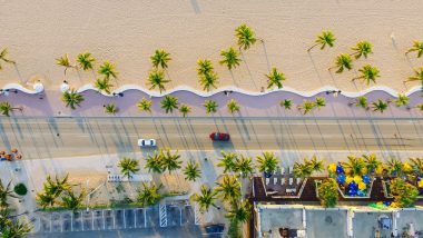 Top down view of a scenic drive along the sandy beach in Florida