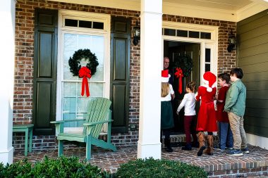 Kids go caroling on Christmas Eve, singing at their neighbors.