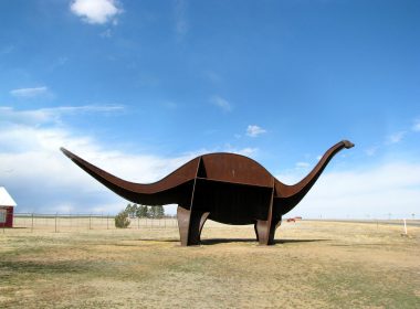 A life-size dinosaur sculpture in the shape of an Apatosaurus named Cimmy sits outside of the Cimarron Heritage Center in Boise City, OK.