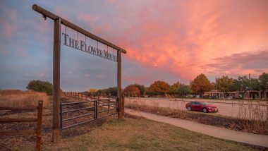 A wooden archway denotes the location of The Flower Mound, where the land is kept undisturbed in Flower Mound, TX.