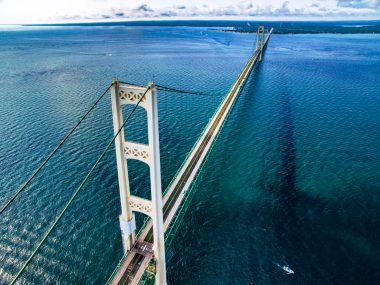 Aerial view of the Mackinac Bridge through the straights connectiong the upper and lower peninsulas of Michigan.