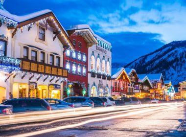 A street with Bavarian buildings lit up with lights in the winter in Leavenworth, Washington.