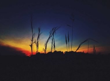 A red, yellow, and dark blue sunset over Cuyahoga Valley National Park in Ohio