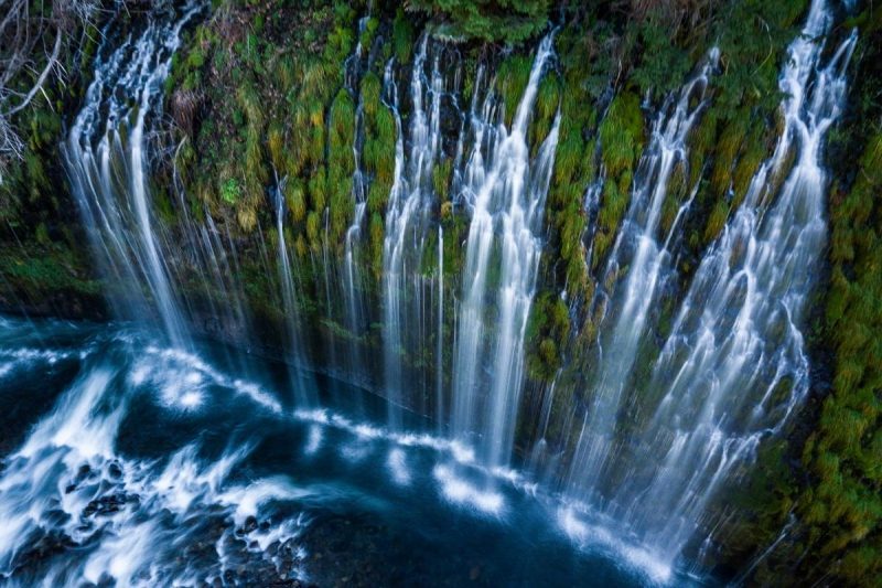 Mossbrae Falls in California is a waterfall over a mossy cliff with several streams.