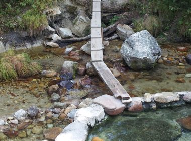 A wooden walkway to the hot springs pools at Trail Creek.