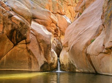 A waterfall rolls down a canyon into Guffey Gorge