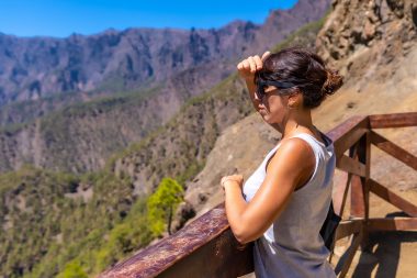 A young tourist looking at the landscape.