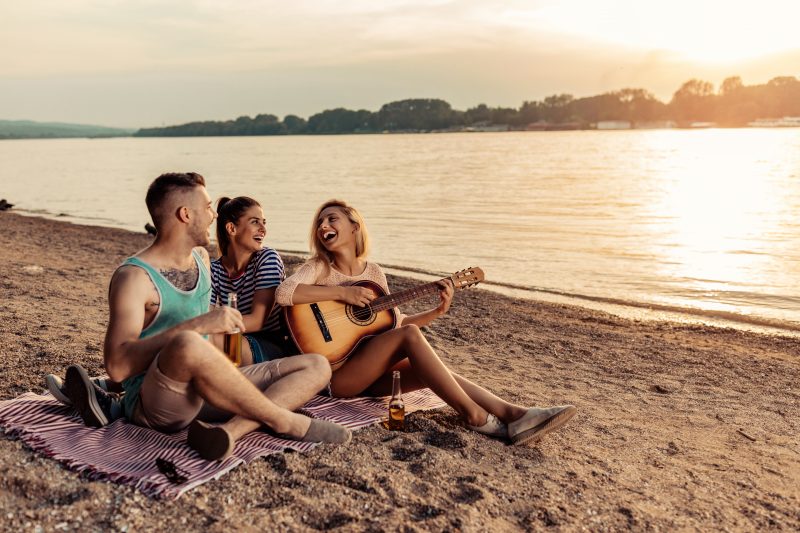Friends singing on the Singing Beach in Massachusetts.