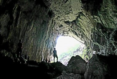 Person exploring the Cave of the Evil Spirit