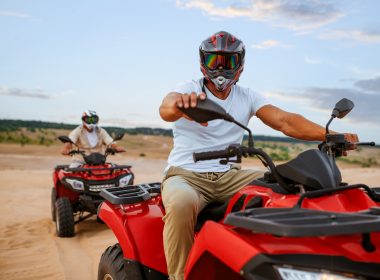 Two men driving ATVs at Mines and Meadows