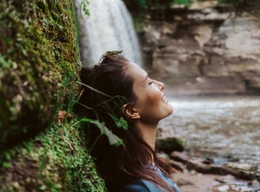 Woman standing beside Glen Ellis Falls