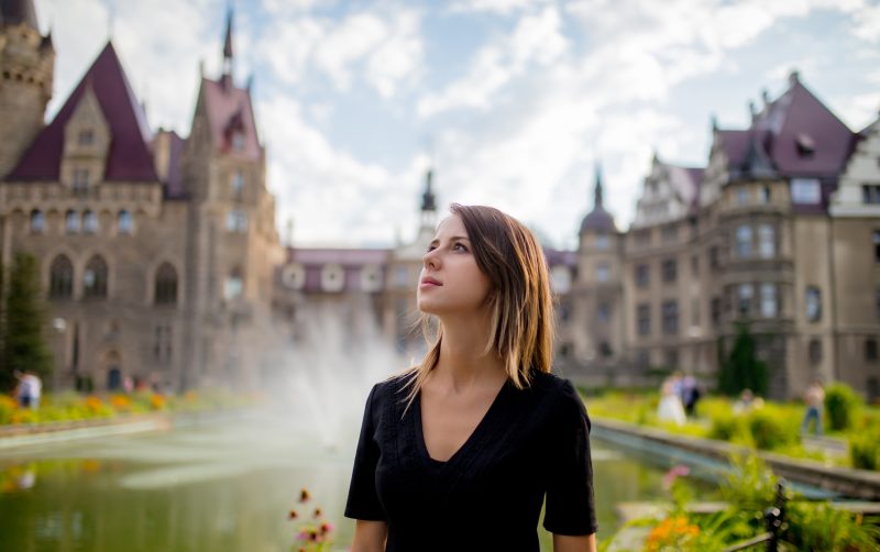 Woman exploring castle in New York