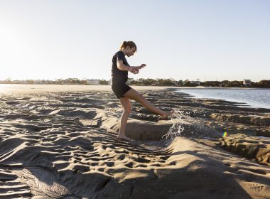 Girl playing in sand in Assawoman Wildlife Area