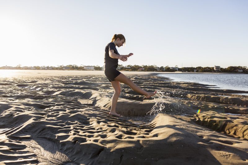 Girl playing in sand in Assawoman Wildlife Area