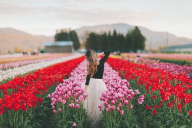 Woman posing in tulip farm in New Jersey