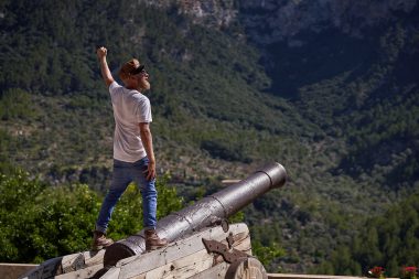 Man standing over cannon in Fort Hancock New Jersey