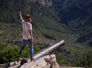 Man standing over cannon in Fort Hancock New Jersey