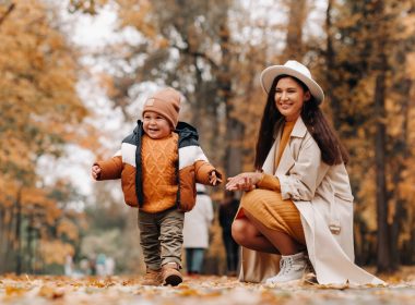 Mom and son walking through Alapocas Run State Park in the autumn