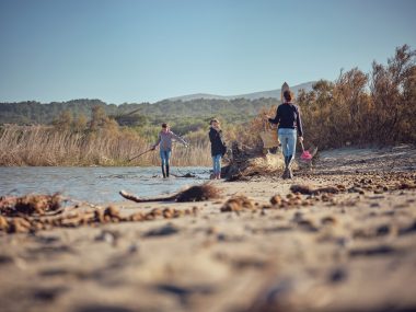 Family walking through the James Farm Ecological Preserve