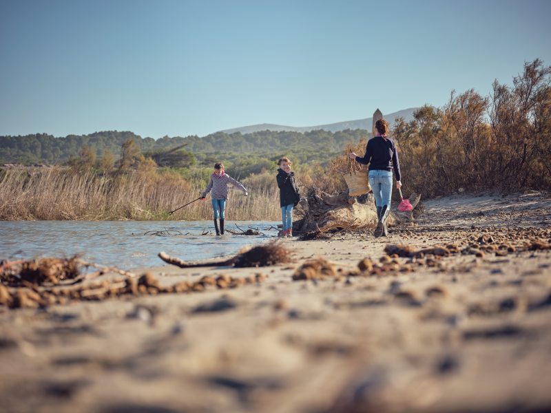 Family walking through the James Farm Ecological Preserve