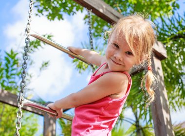 Girl climbing on play ground in Duke Island Park