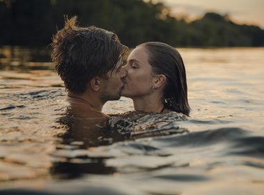 Couple kissing while swimming in Atsion Lake