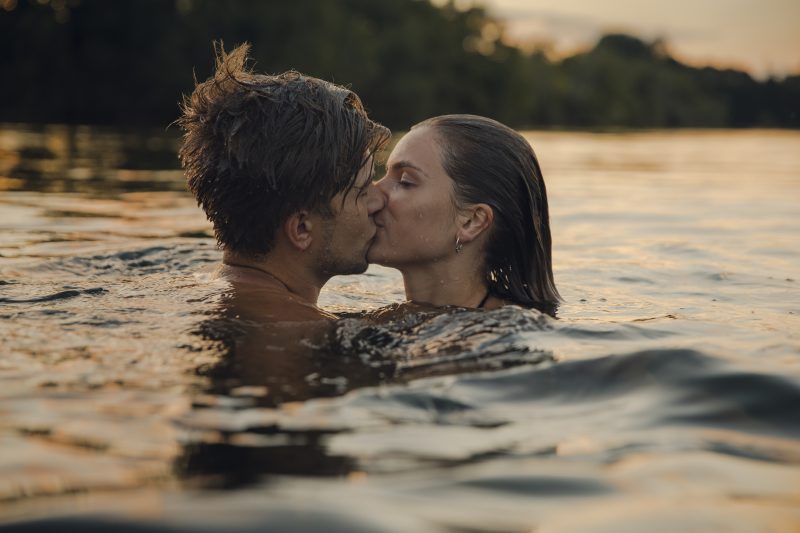 Couple kissing while swimming in Atsion Lake