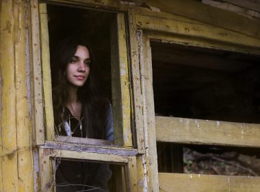 Woman exploring abandoned Bell's Mansion