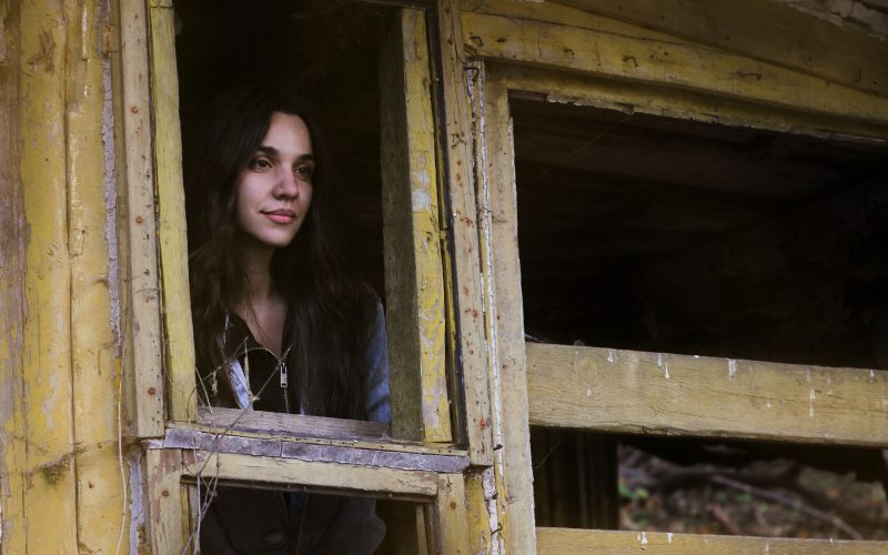 Woman exploring abandoned Bell's Mansion