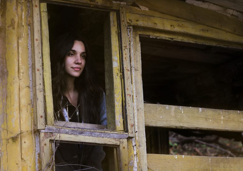 Woman exploring abandoned Bell's Mansion