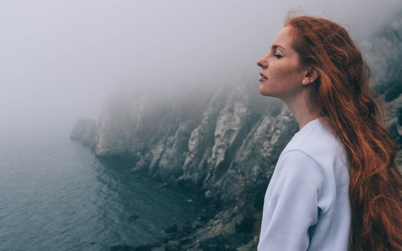Woman looking out at Neahkahnie Viewpoint