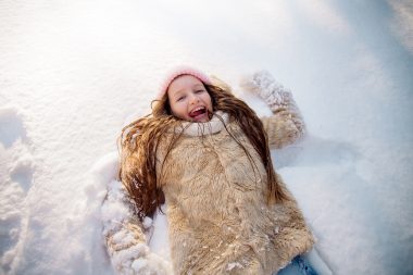 Girl playing in the snow at Frankenmuth Snowfest