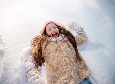 Girl playing in the snow at Frankenmuth Snowfest