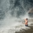 Man swimming in waterfall in NY