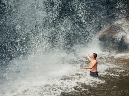Man swimming in waterfall in NY
