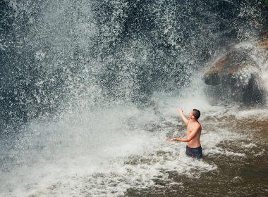 Man swimming in waterfall in NY