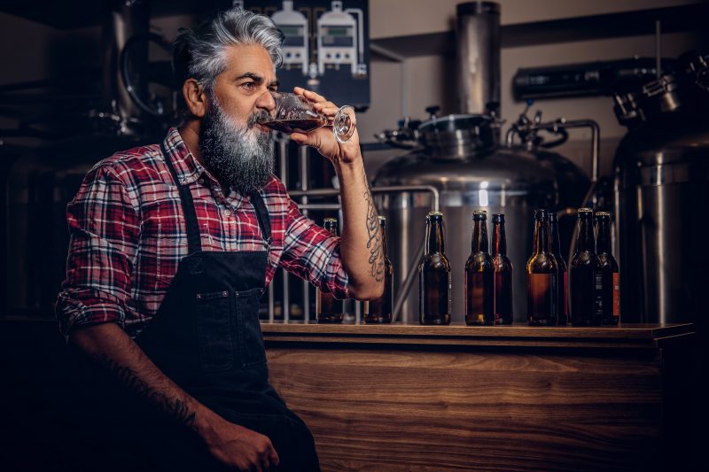 Beer maker drinking beer in St. Louis brewery