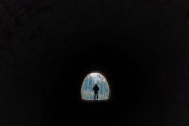 Man walking through Dingess Tunnel