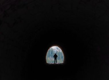 Man walking through Dingess Tunnel