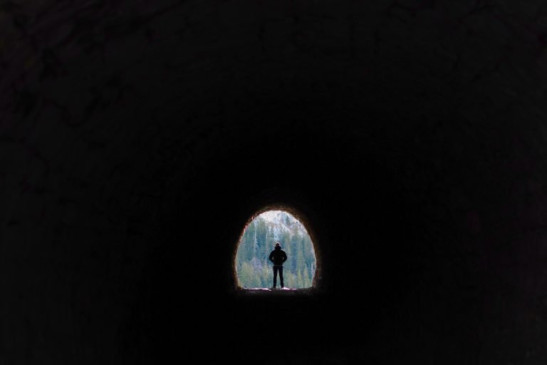 Man walking through Dingess Tunnel