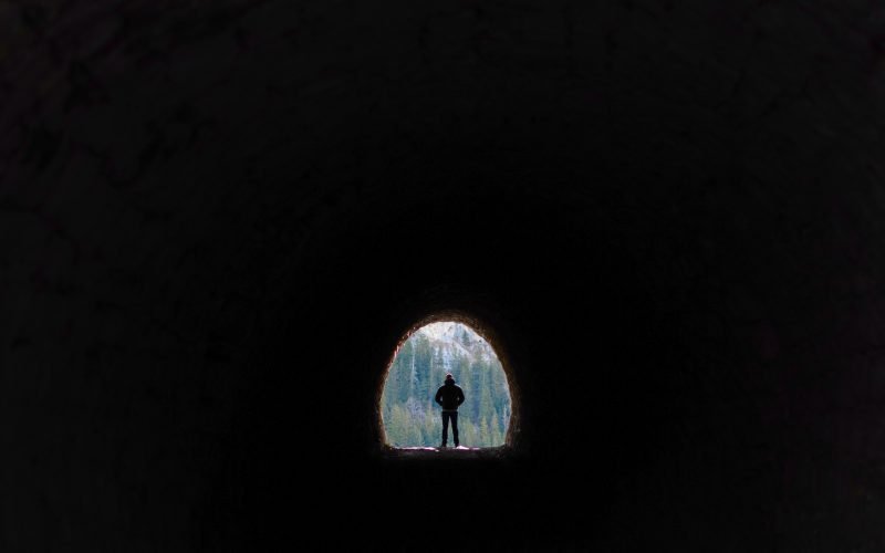 Man walking through Dingess Tunnel